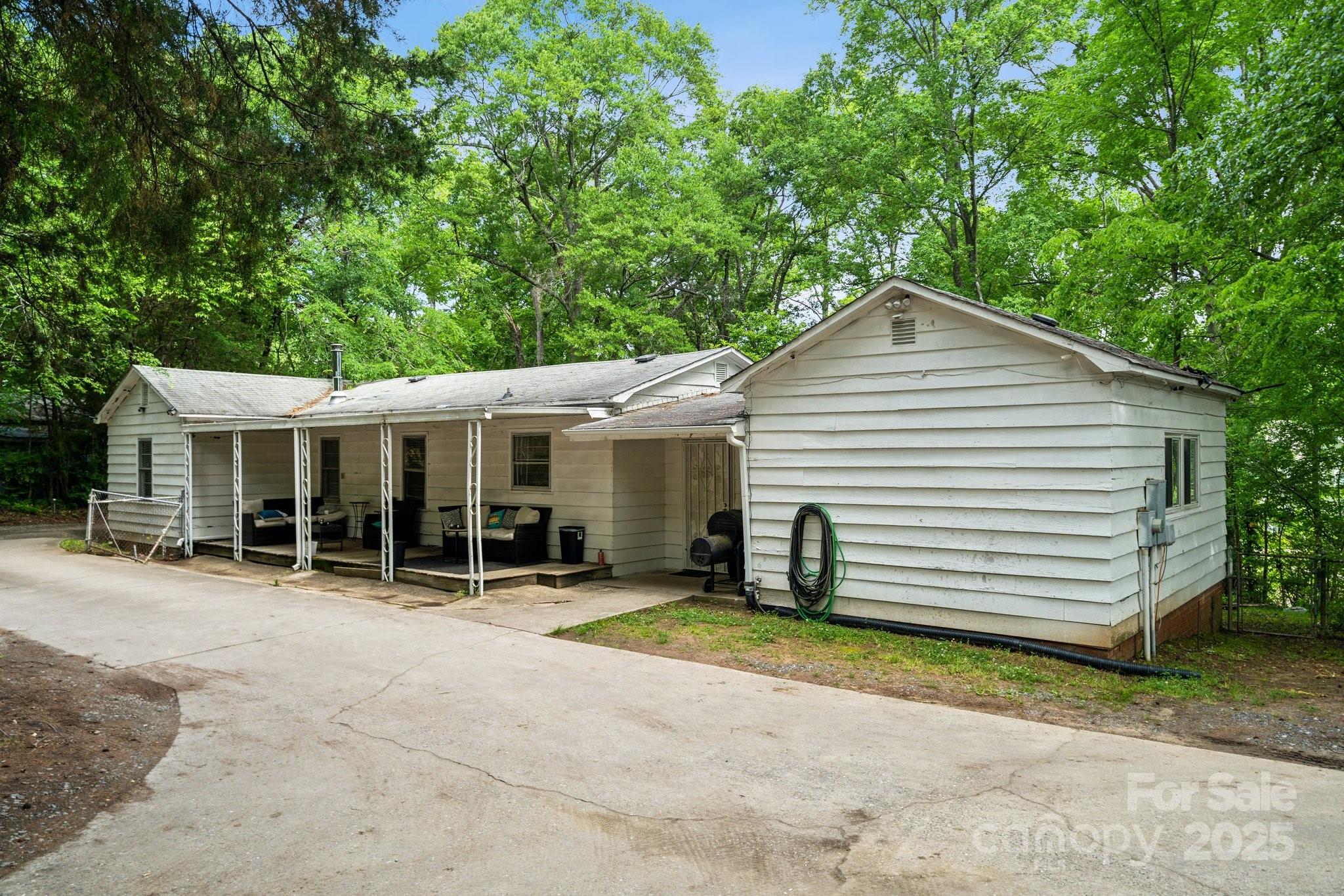 1917 Tom Sadler Road Charlotte, NC 28214 - Photo 23 of 27 a view of a house with a yard