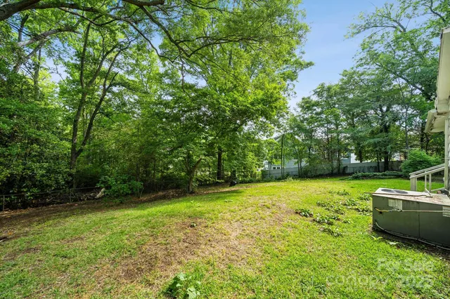 a view of a backyard with a small cabin