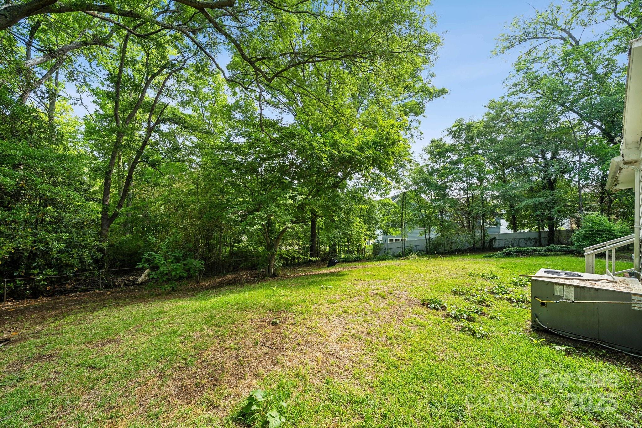 1917 Tom Sadler Road Charlotte, NC 28214 - Photo 26 of 27 a view of a backyard with a small cabin