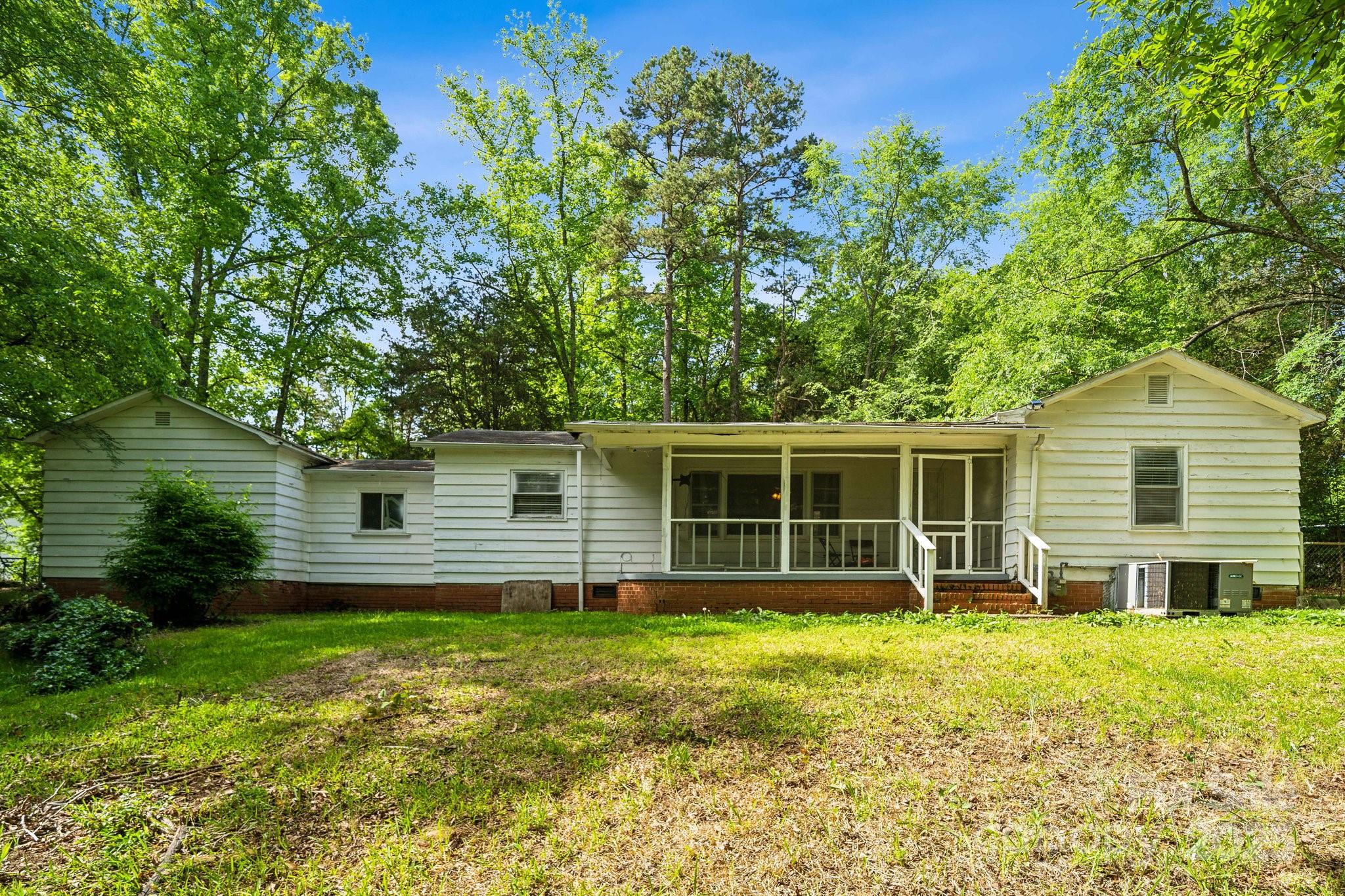 1917 Tom Sadler Road Charlotte, NC 28214 - Photo 5 of 27 a house view with a garden space