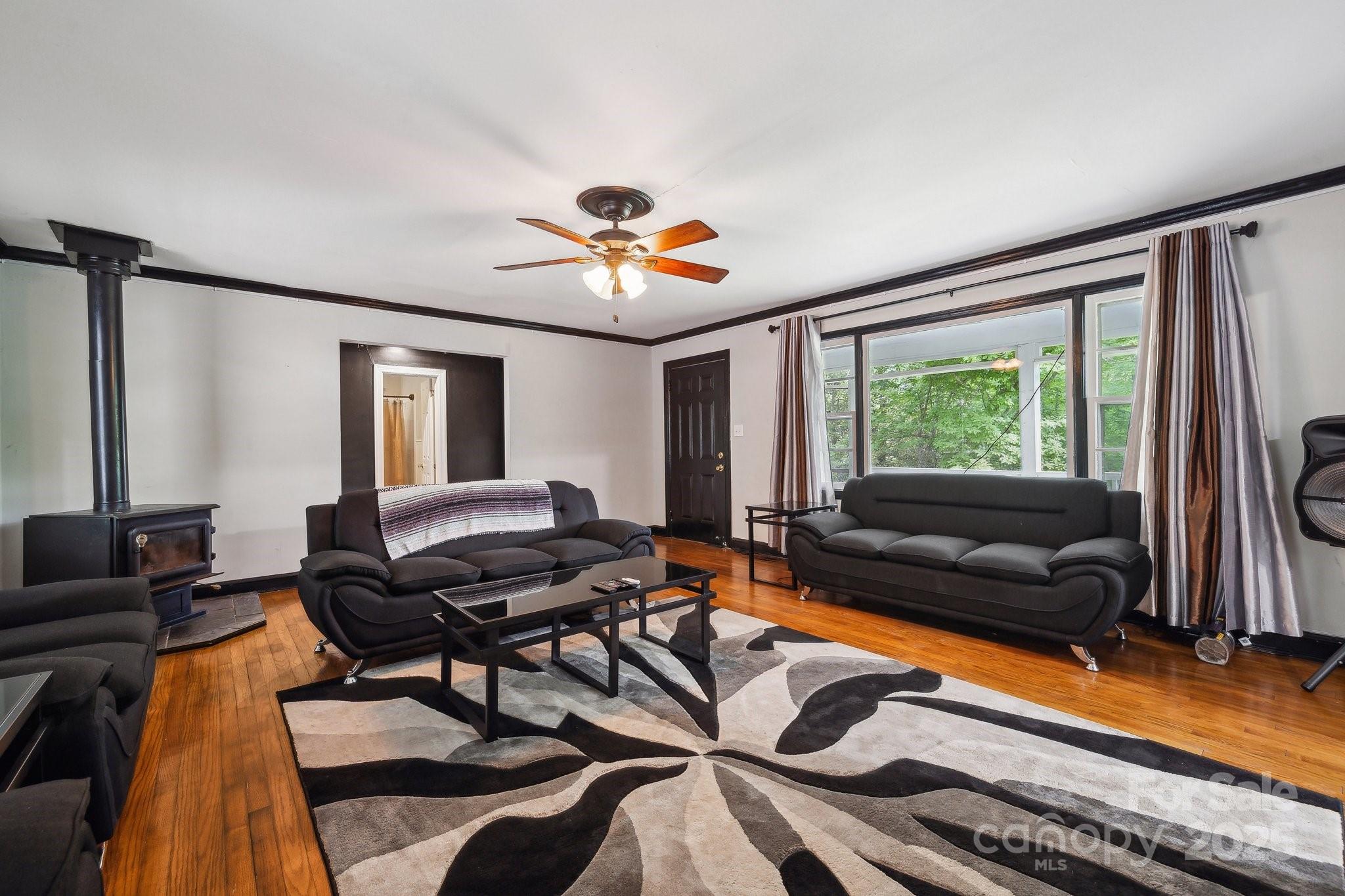 1917 Tom Sadler Road Charlotte, NC 28214 - Photo 6 of 27 a living room with furniture and a flat screen tv