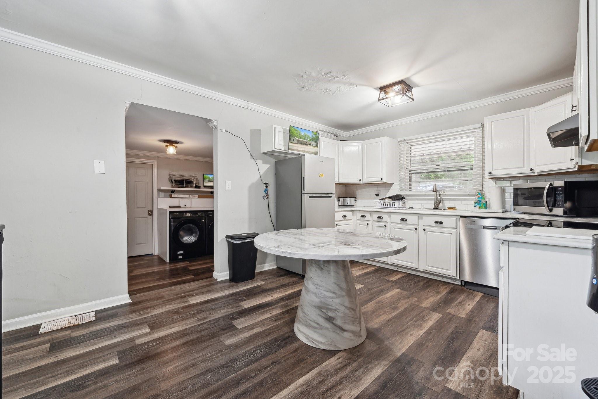 1917 Tom Sadler Road Charlotte, NC 28214 - Photo 9 of 27 a kitchen with a sink appliances and cabinets