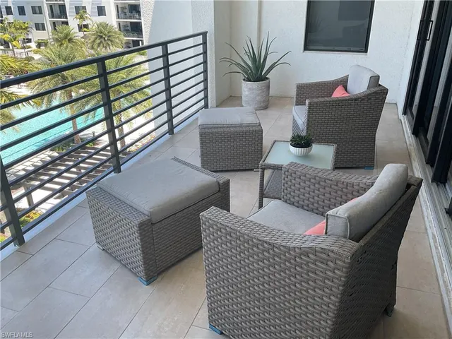 a view of outdoor kitchen with seating space