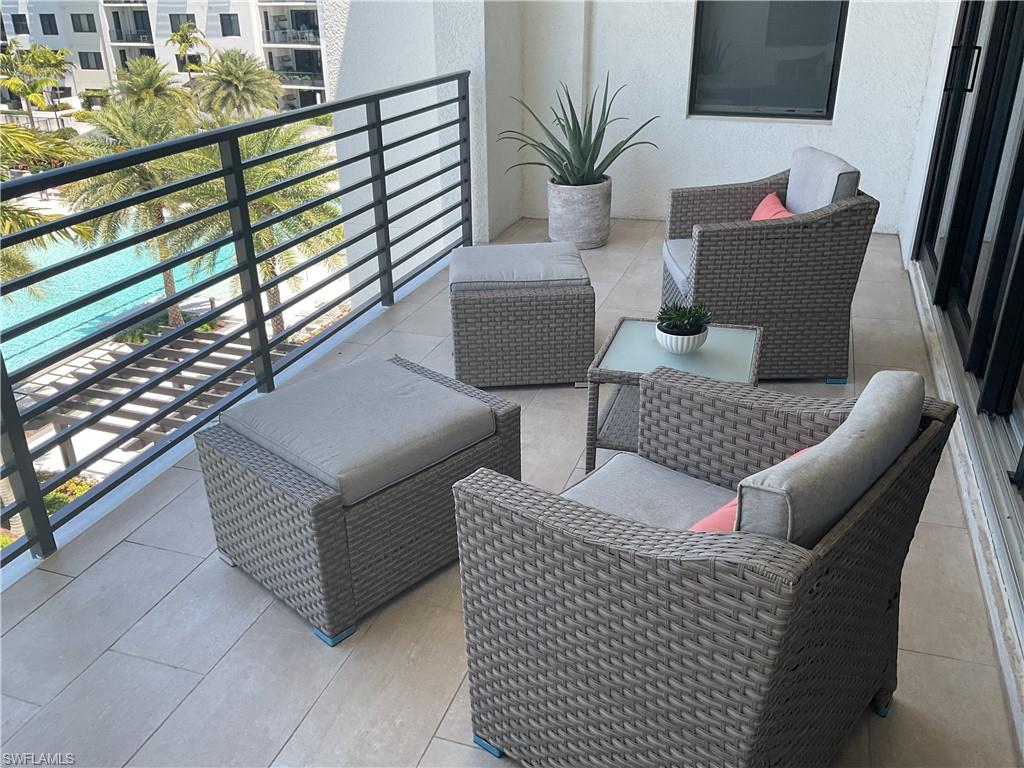 1111 Central Avenue, Unit 506 Naples, FL 34102 - Photo 16 of 21 a view of outdoor kitchen with seating space