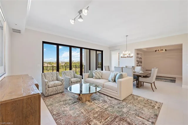 a living room with furniture wooden floor and a table