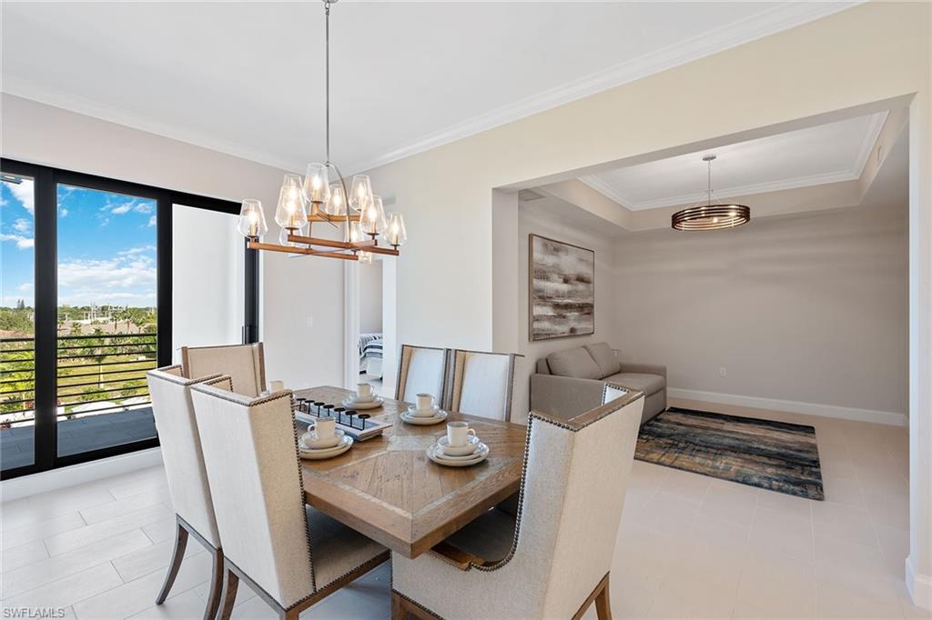 1111 Central Avenue, Unit 506 Naples, FL 34102 - Photo 9 of 21 a view of a dining room with furniture window and outside view