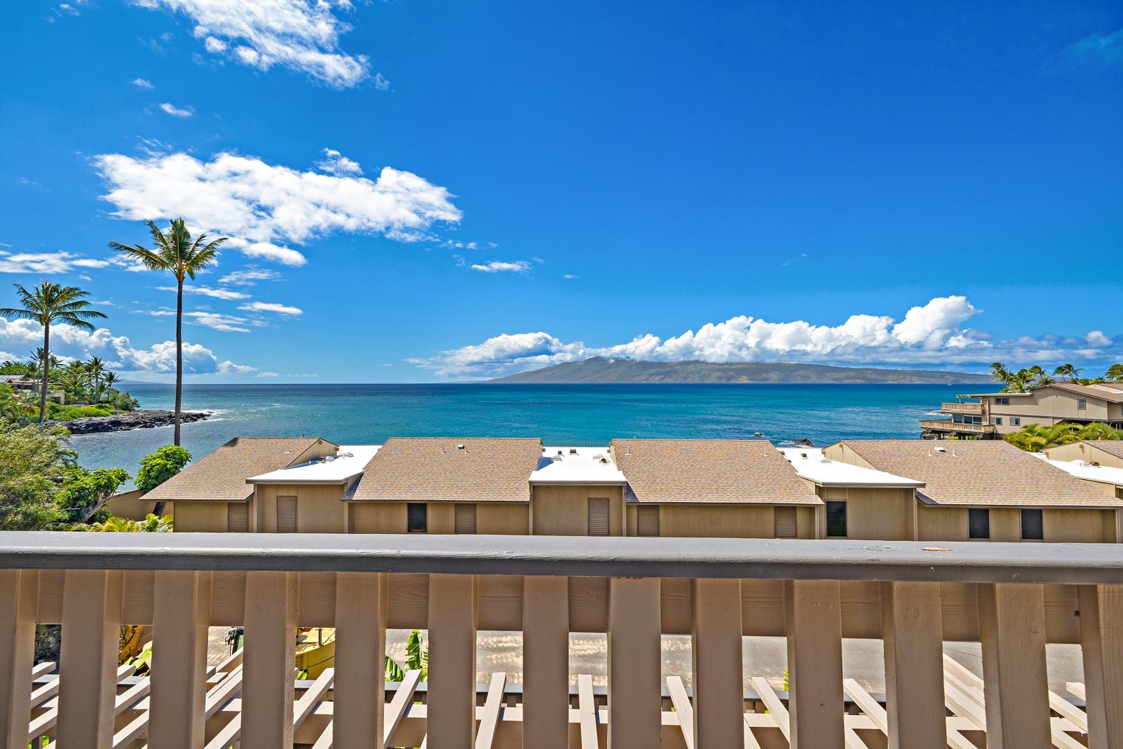 4909 Lower Honoapiilani Road, Unit E5 Lahaina, HI 96761 - Photo 1 of 28 a front view of house with yard space and ocean view