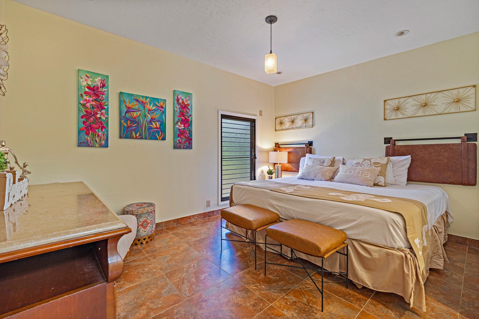 4909 Lower Honoapiilani Road, Unit E5 Lahaina, HI 96761 - Photo 20 of 28 a bedroom with a bed and wooden floor