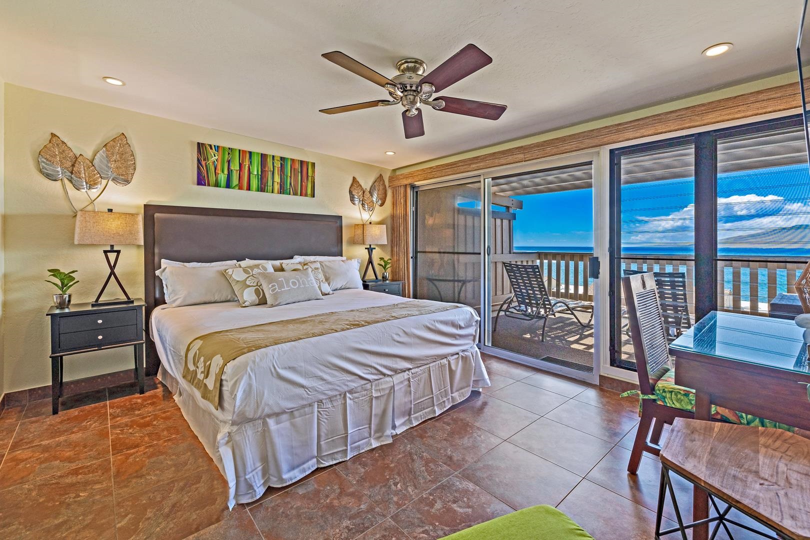 4909 Lower Honoapiilani Road, Unit E5 Lahaina, HI 96761 - Photo 8 of 28 a bedroom with a bed and a large window