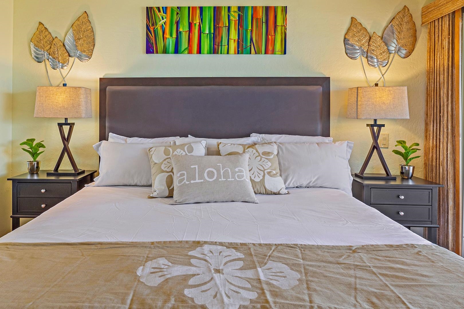 4909 Lower Honoapiilani Road, Unit E5 Lahaina, HI 96761 - Photo 10 of 28 a bedroom with a bed and a lamp on dresser