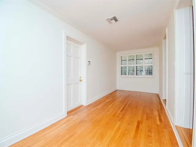 a view of empty room with windows