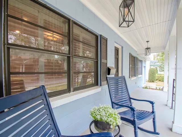 a view of a living room and a balcony