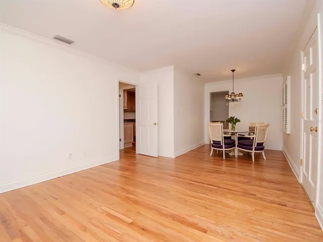 a dining room with furniture and entryway