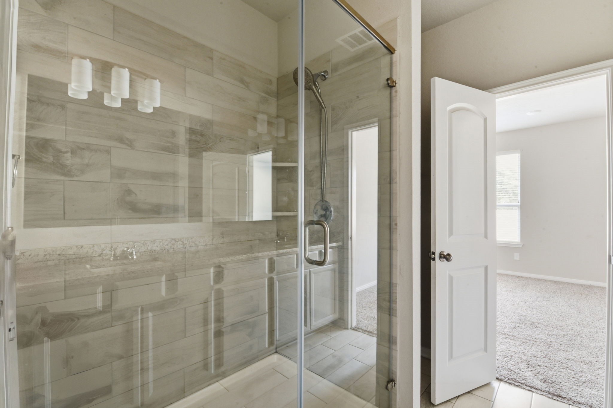 115 Austin Street Angleton, TX 77515 - Photo 16 of 33 a bathroom with a shower