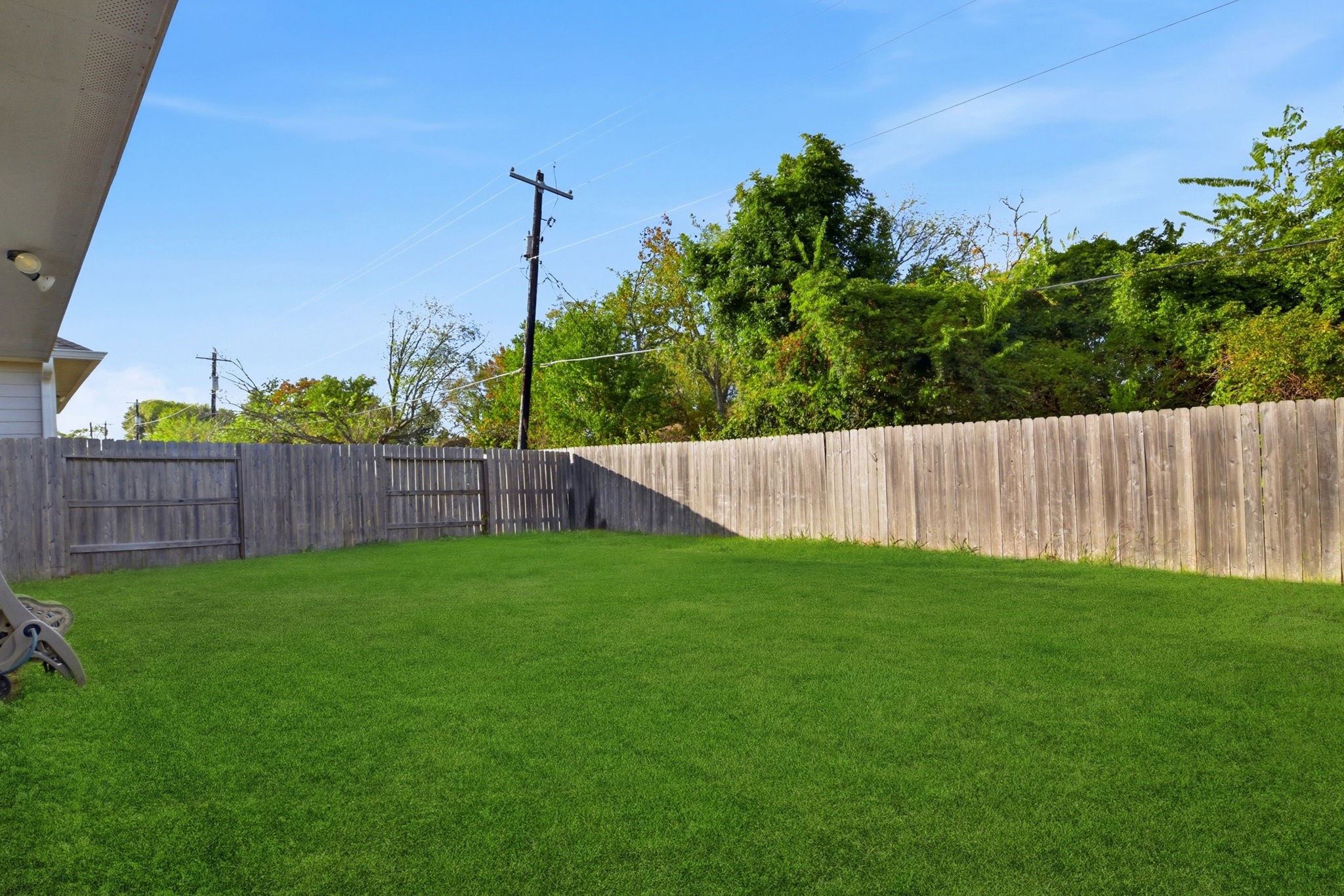 115 Austin Street Angleton, TX 77515 - Photo 31 of 33 a view of a backyard with a fence
