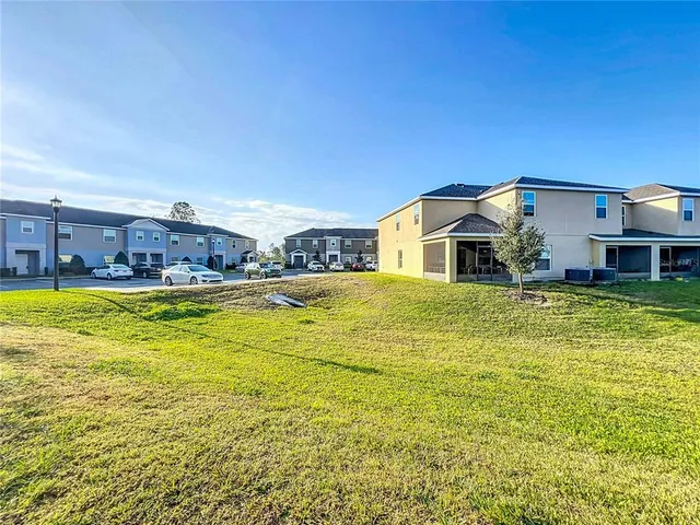 a house view with swimming pool in front of it