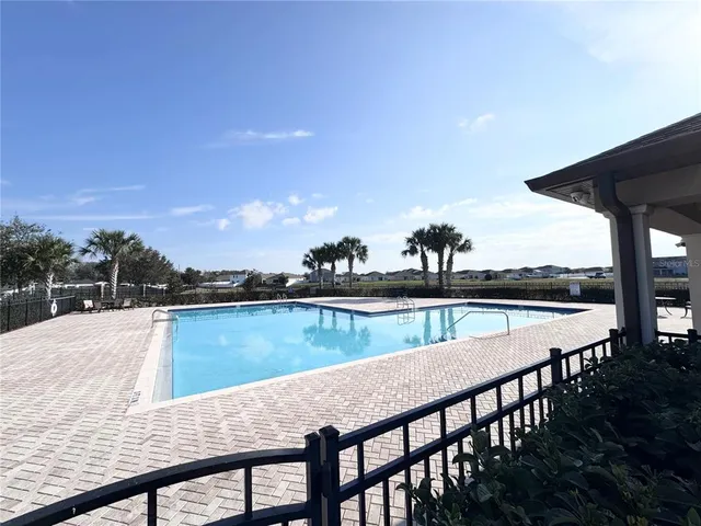 a view of swimming pool from a balcony