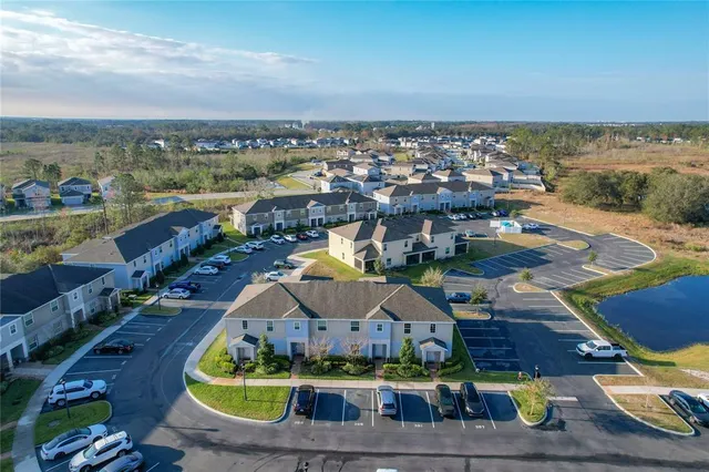 a kitchen with stainless steel appliances kitchen island granite countertop a sink and cabinets