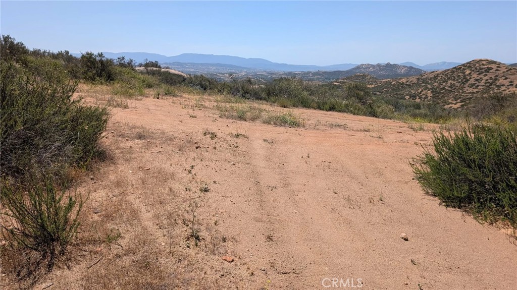 0 Newby Road Temecula, CA 92592 - Photo 6 of 9 a view of a dry yard with mountains in the background
