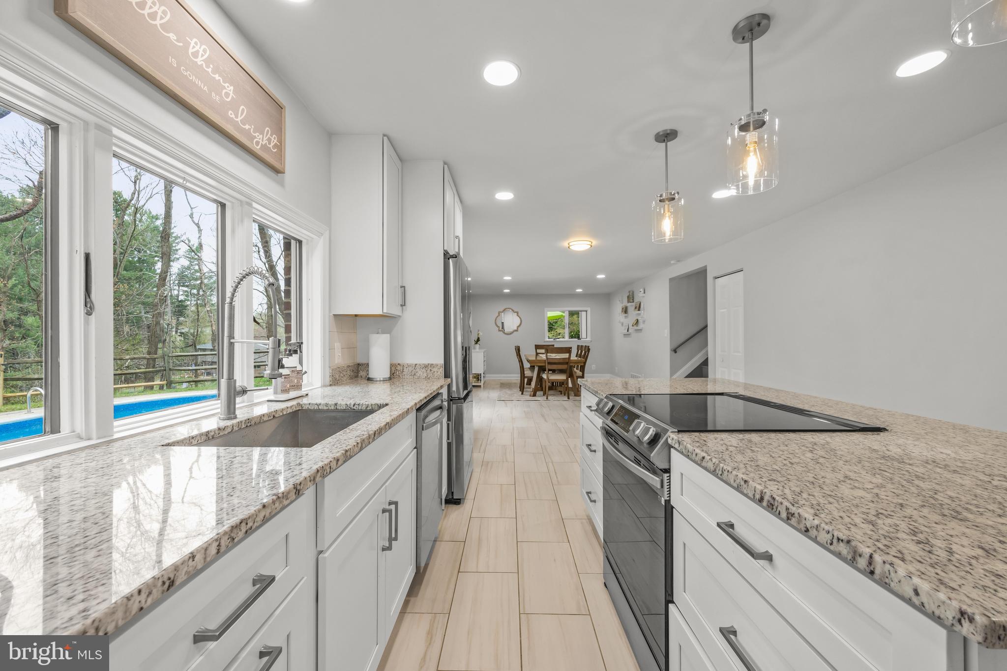 2414 Derby Drive Fallston, MD 21047 - Photo 16 of 41 a large kitchen with kitchen island a large counter space a sink appliances and a large window
