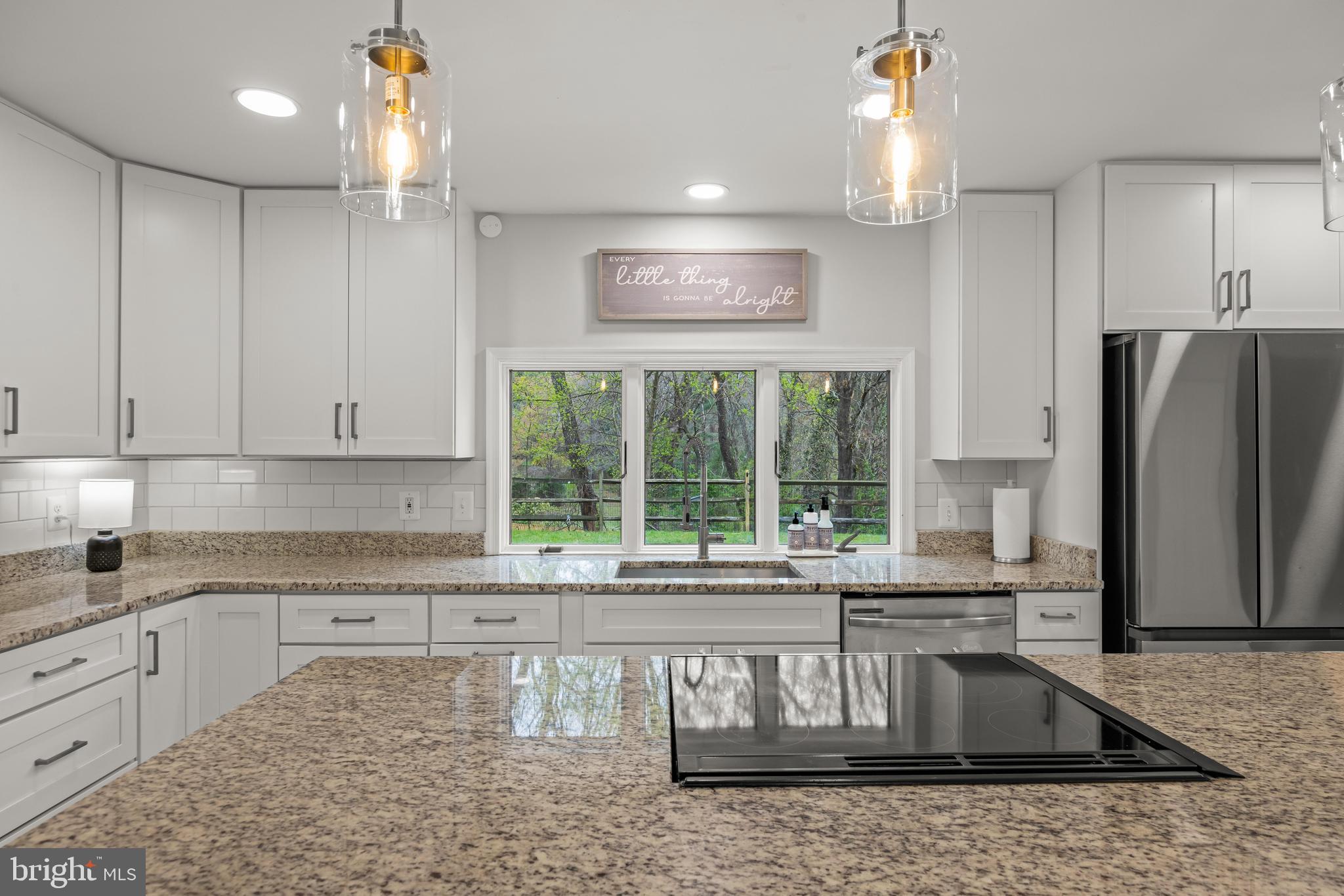 2414 Derby Drive Fallston, MD 21047 - Photo 17 of 41 a kitchen with stainless steel appliances granite countertop a refrigerator a sink a stove and white cabinets