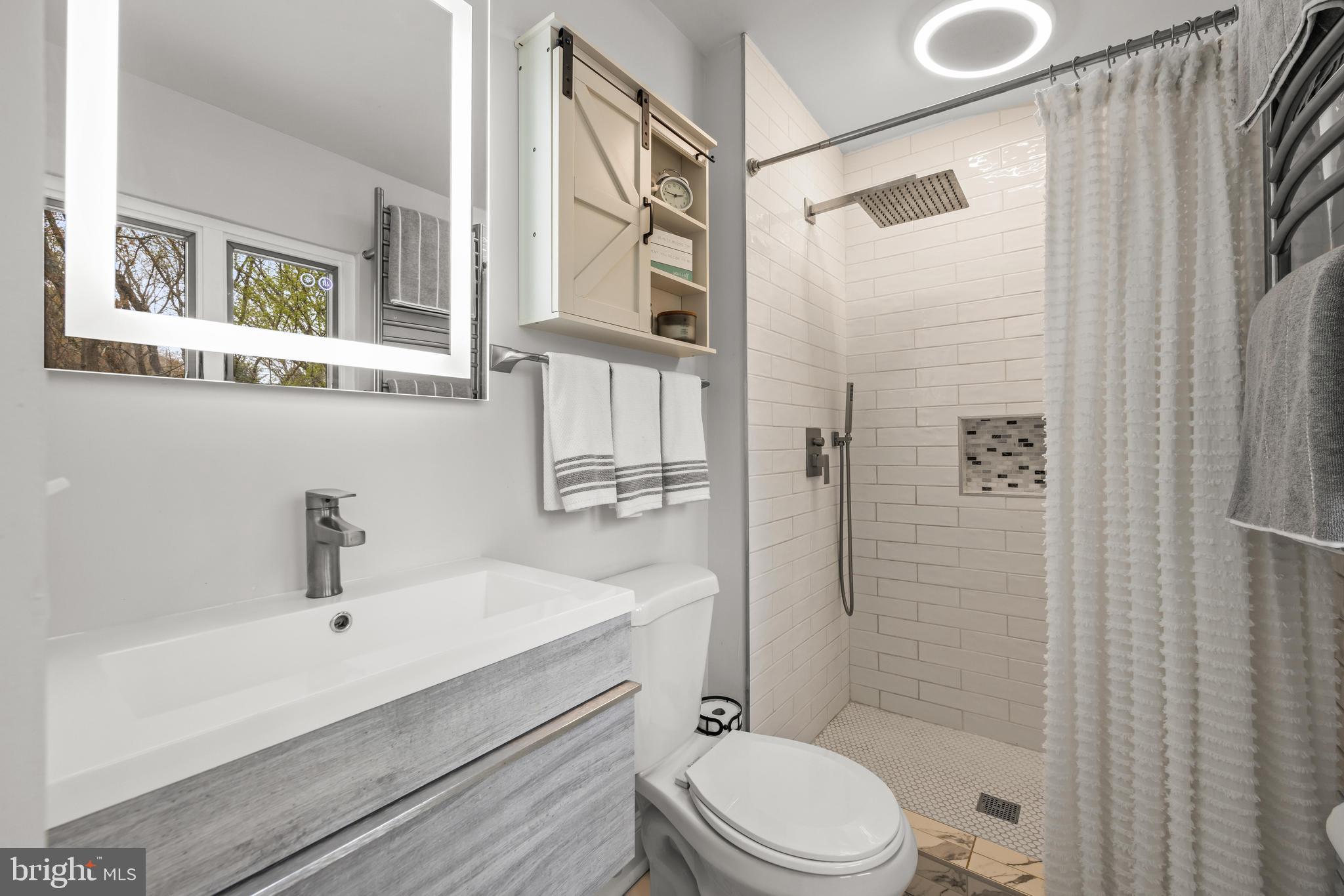 2414 Derby Drive Fallston, MD 21047 - Photo 25 of 41 a bathroom with a sink a toilet and shower