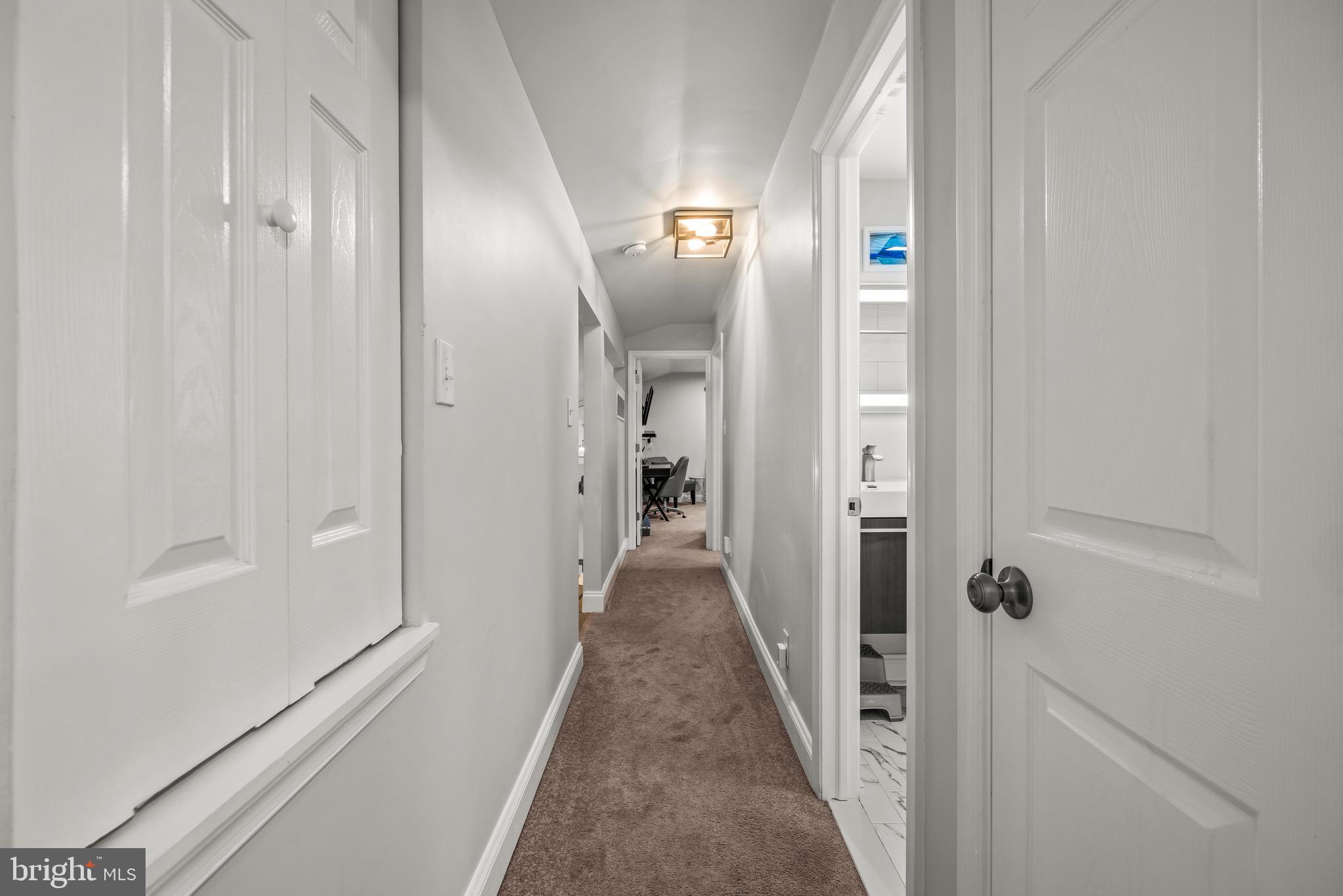 2414 Derby Drive Fallston, MD 21047 - Photo 26 of 41 a view of a hallway with wooden floor and staircase