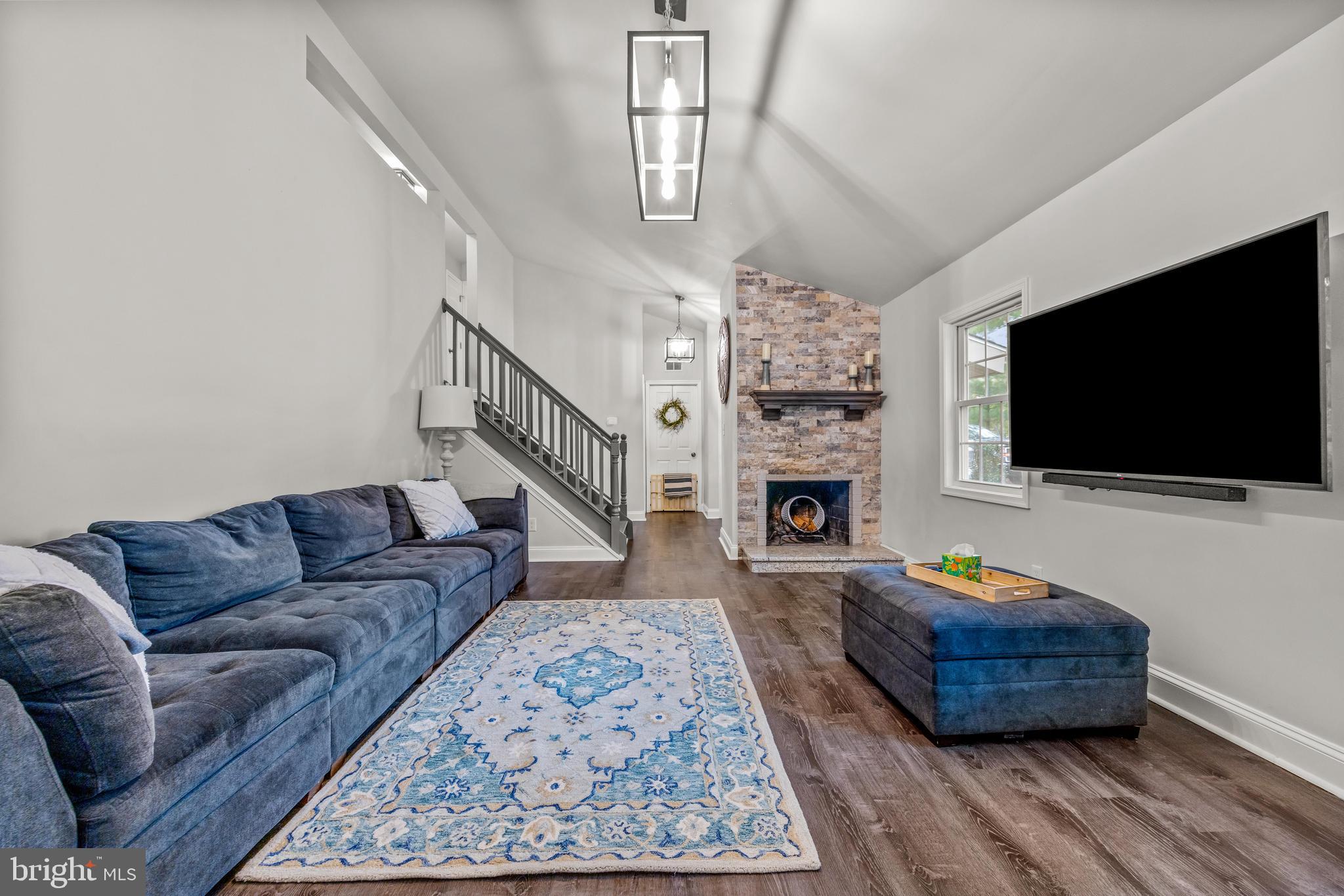 2414 Derby Drive Fallston, MD 21047 - Photo 7 of 41 a living room with furniture a flat screen tv and a fireplace