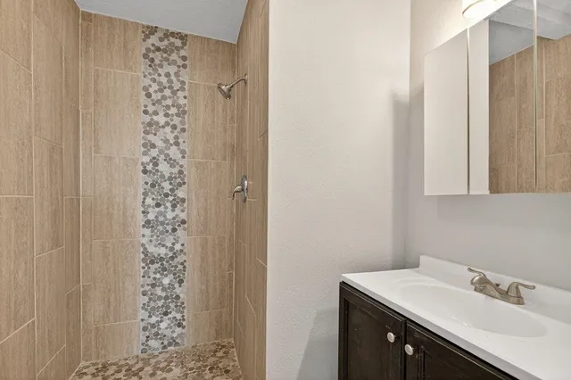 a bathroom with a sink and a shower curtain