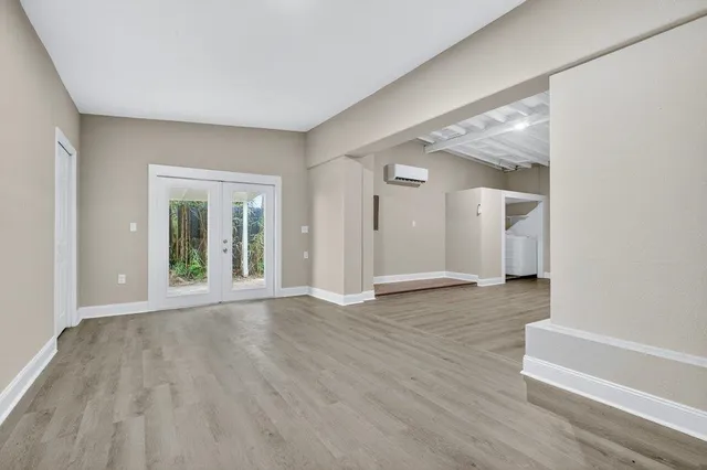a view of a kitchen cabinets and wooden floor