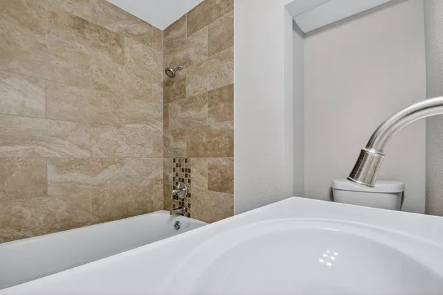a bathroom with a white bath tub