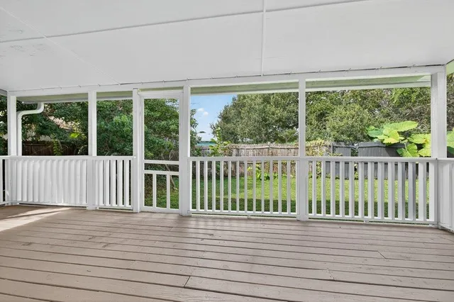 a view of balcony with wooden floor