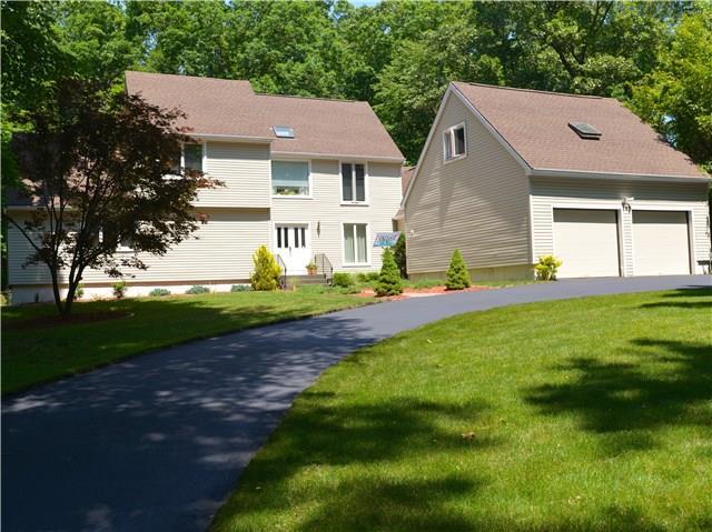 25 Hop Brook Road Brookfield, CT 06804 - Photo 1 of 1 a front view of a house with a yard and garage