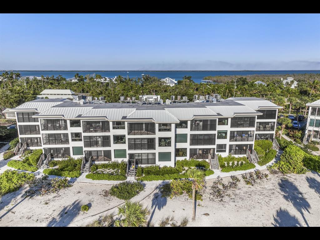 5000 Gasparilla Road, Unit BC201 Boca Grande, FL 33921 - Photo 11 of 25 a view of a building with a yard