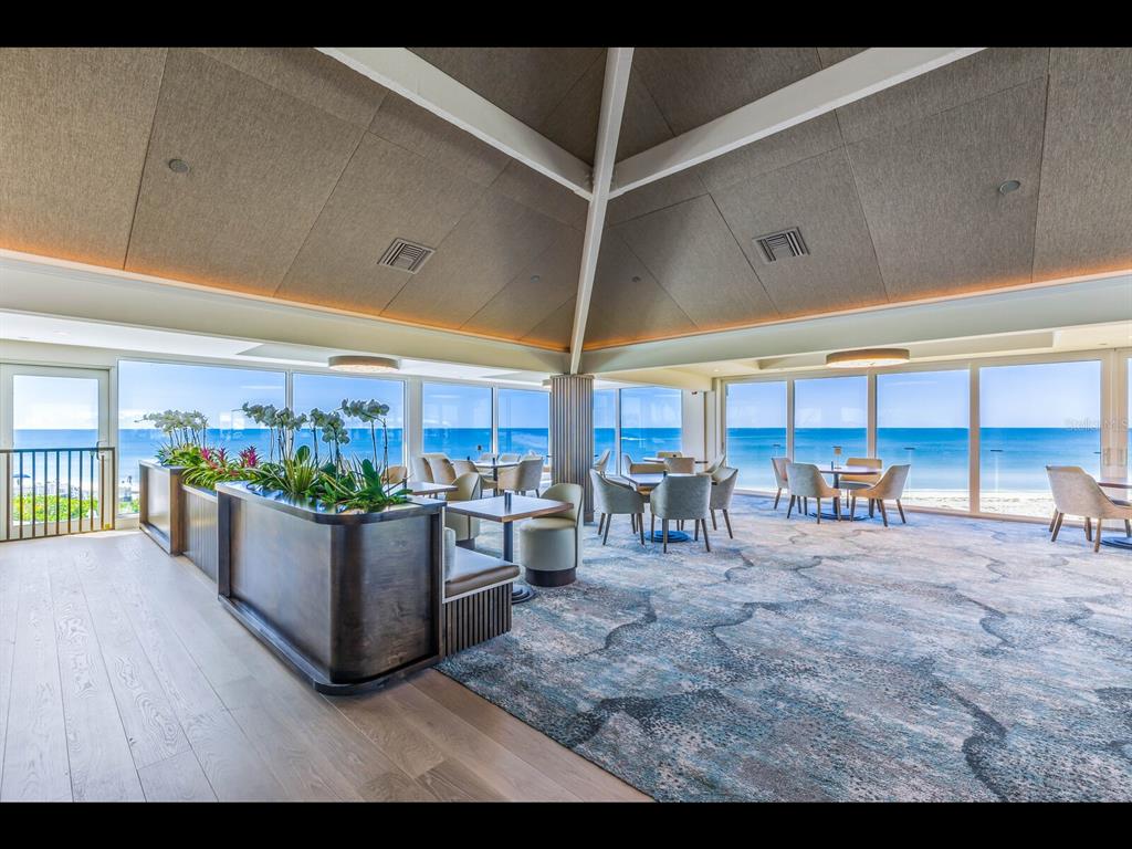 5000 Gasparilla Road, Unit BC201 Boca Grande, FL 33921 - Photo 20 of 25 a living room with lots of furniture and clutter