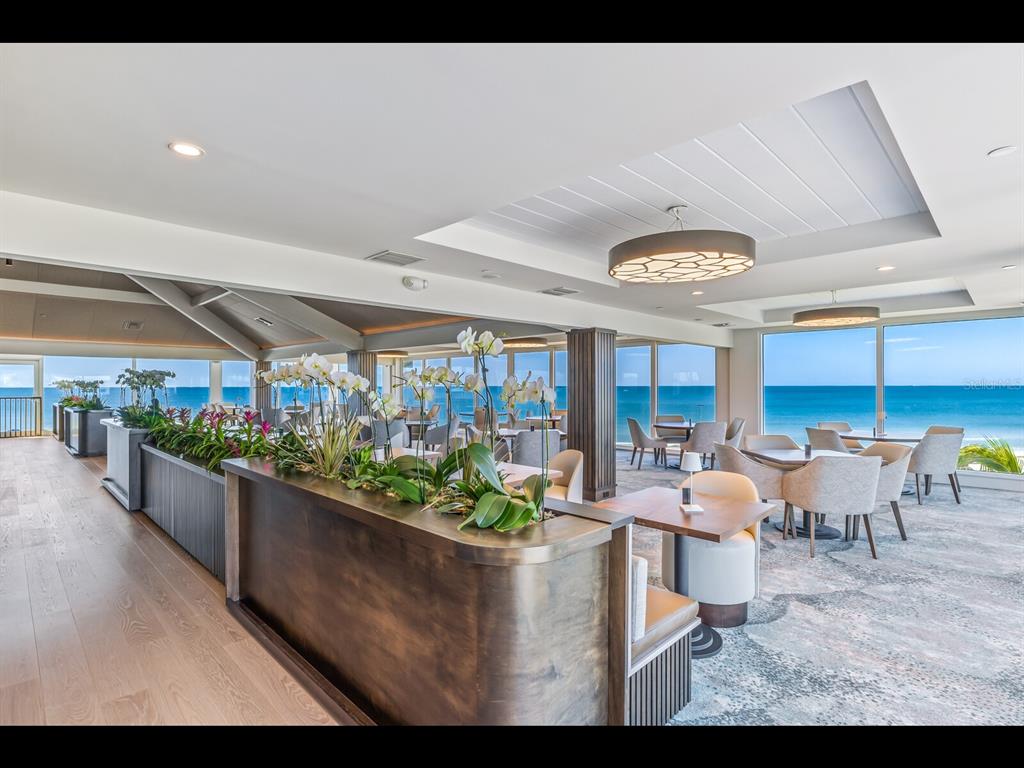 5000 Gasparilla Road, Unit BC201 Boca Grande, FL 33921 - Photo 22 of 25 a living room with lots of potted plants