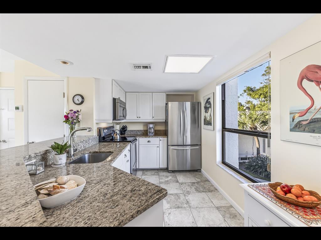 5000 Gasparilla Road, Unit BC201 Boca Grande, FL 33921 - Photo 5 of 25 a living room with furniture and wooden floor
