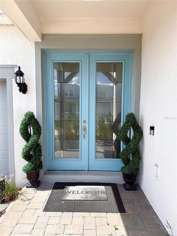 8441 Pk Clf Way Orlando, FL 32836 - Photo 3 of 59 a view of a entryway door of the house