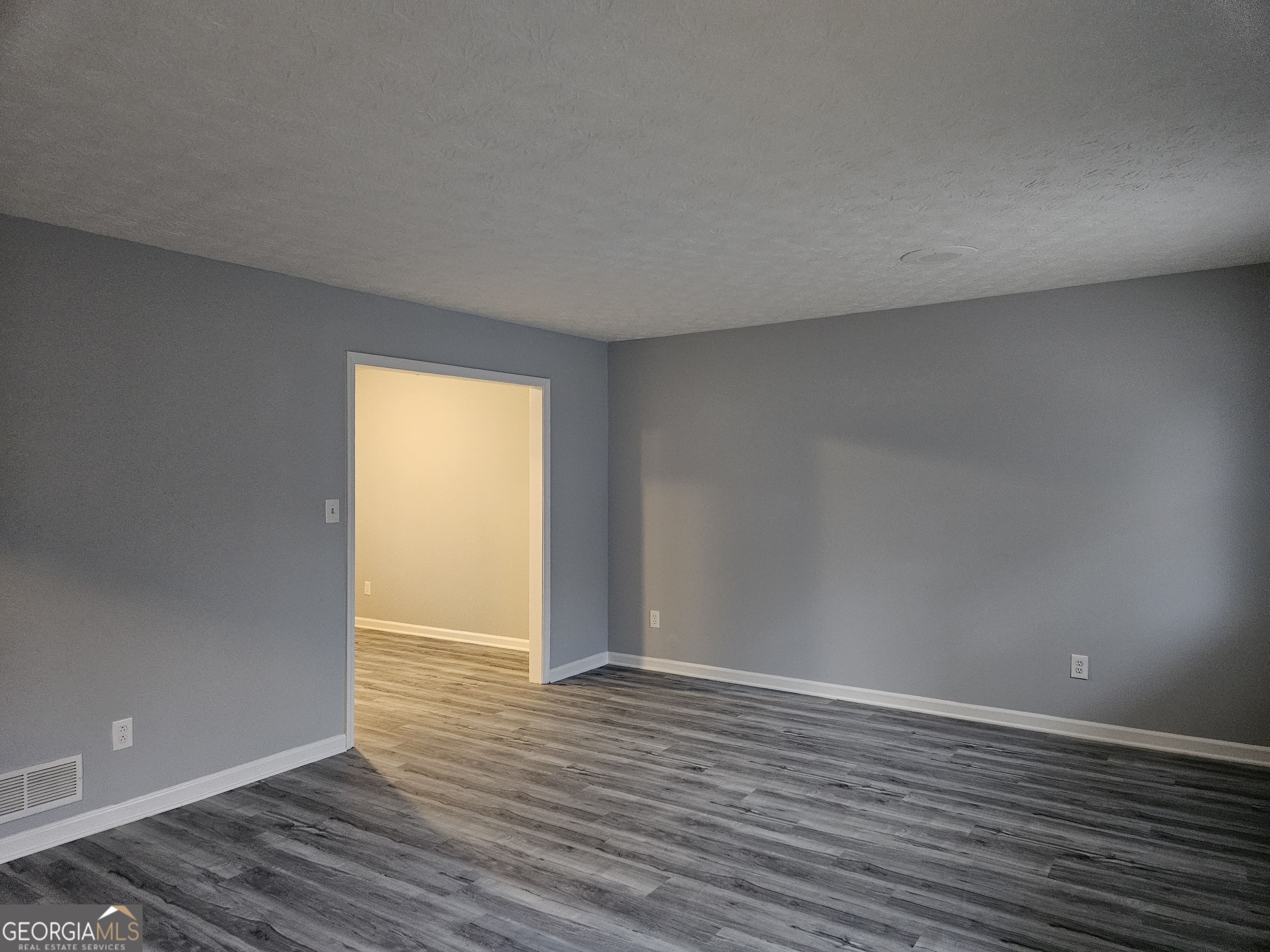 4321 Sebring Walk, Unit 5 Decatur, GA 30034 - Photo 13 of 31 a view of an empty room with wooden floor and a window