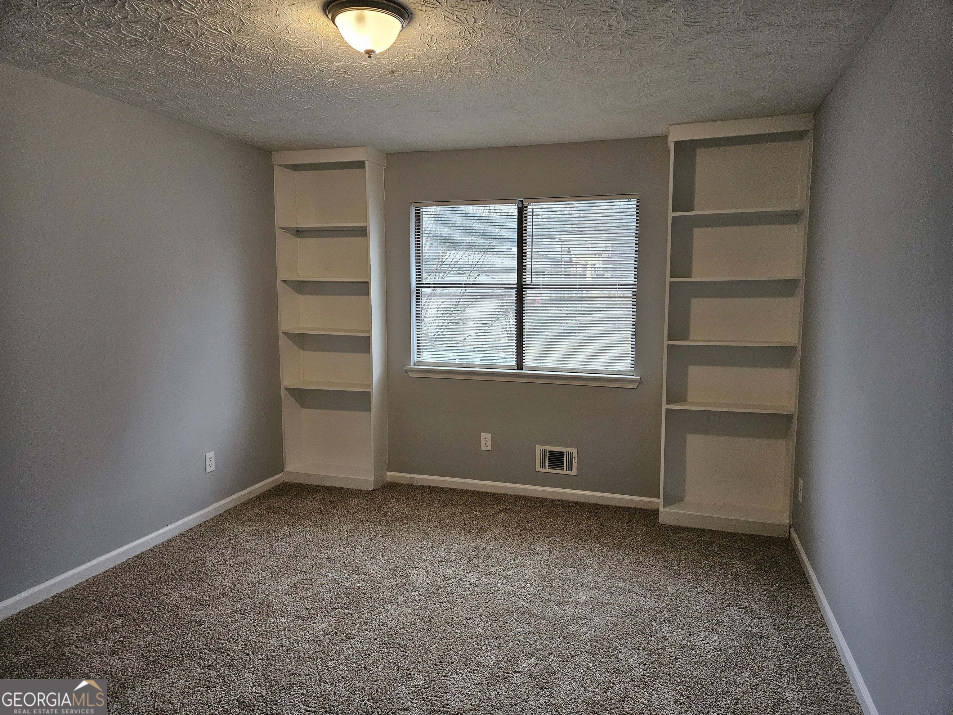 4321 Sebring Walk, Unit 5 Decatur, GA 30034 - Photo 16 of 31 a view of an empty room with a window