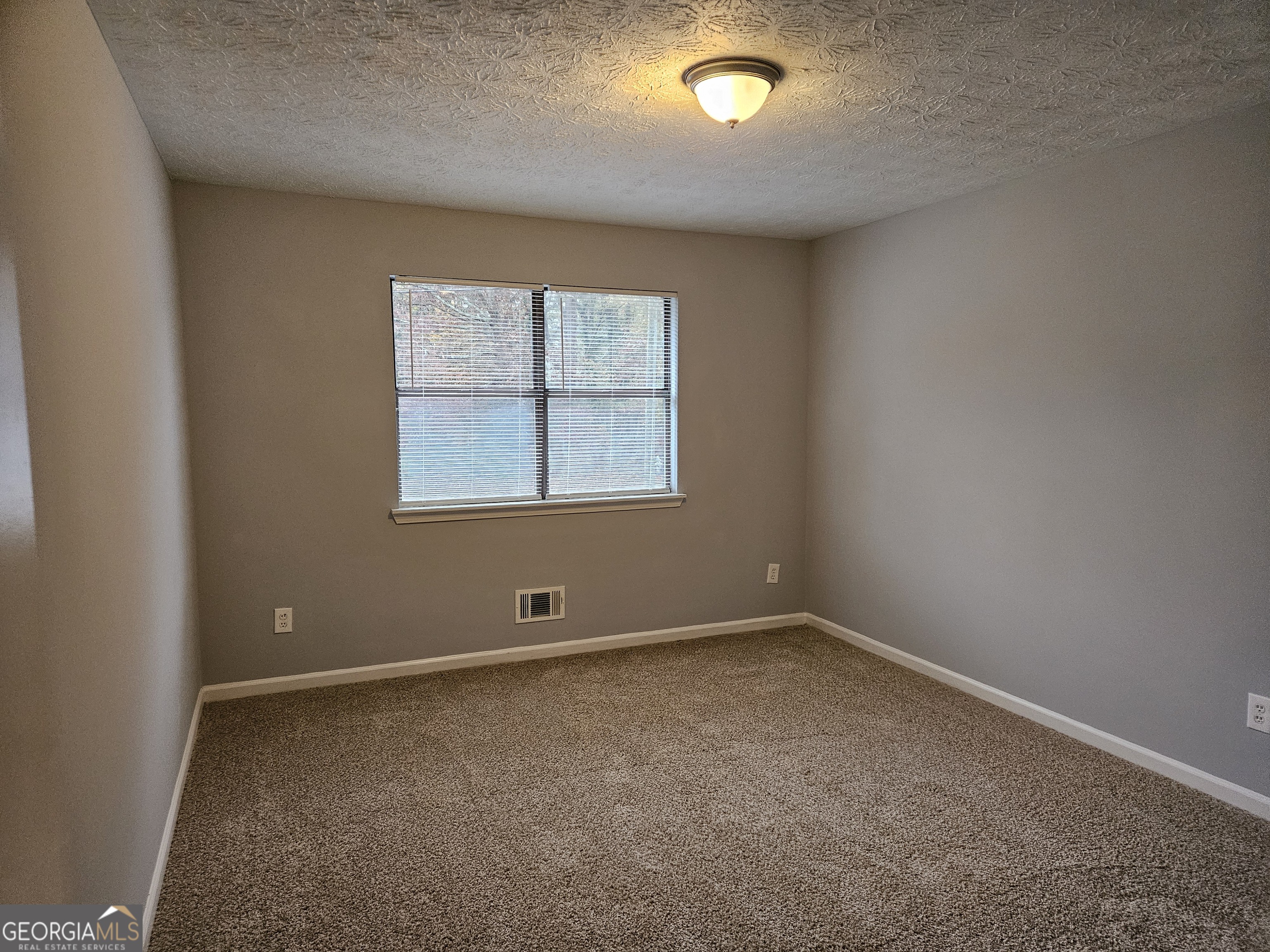 4321 Sebring Walk, Unit 5 Decatur, GA 30034 - Photo 19 of 31 an empty room with a window
