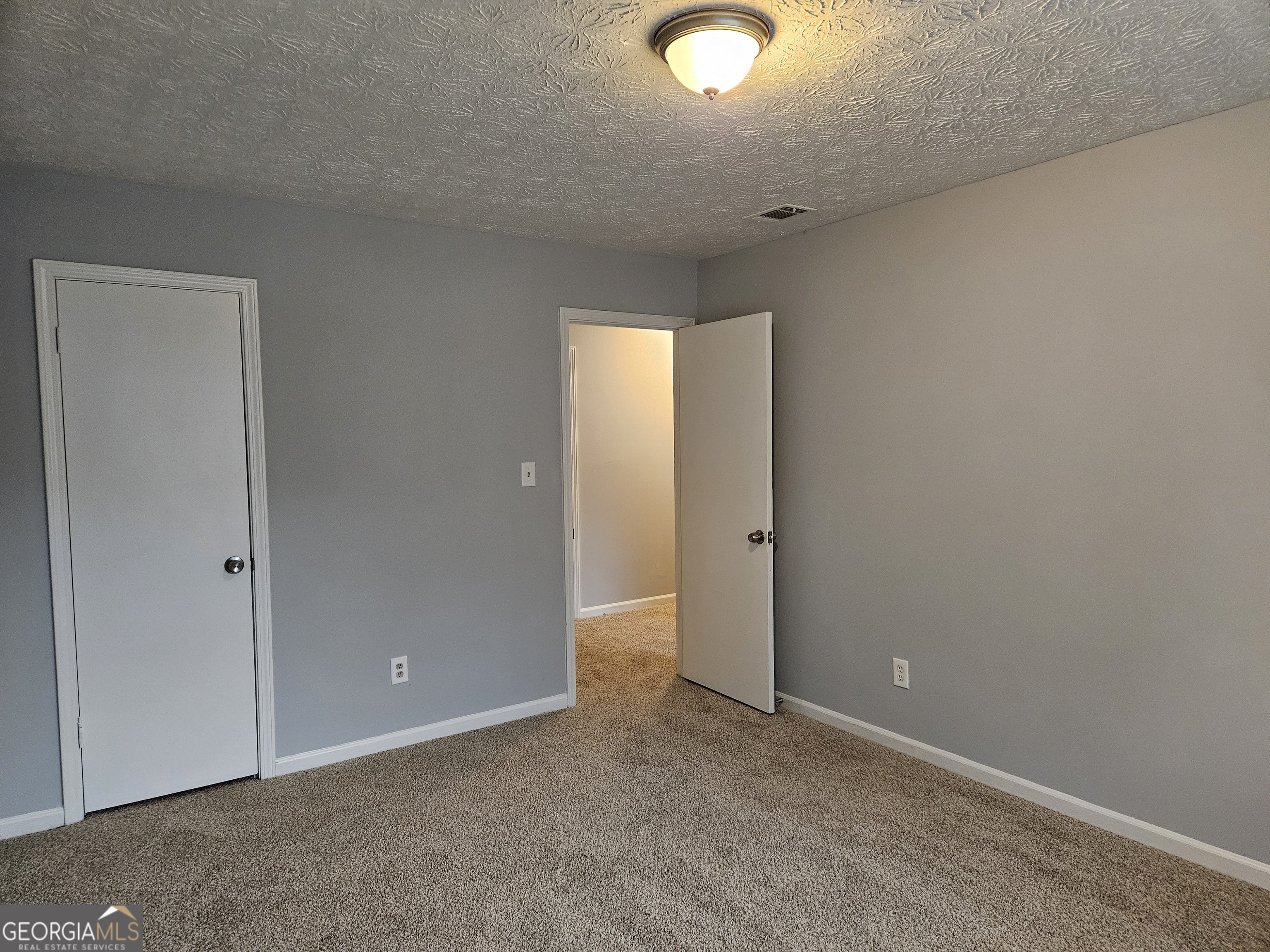 4321 Sebring Walk, Unit 5 Decatur, GA 30034 - Photo 20 of 31 an empty room with a window and a ceiling fan