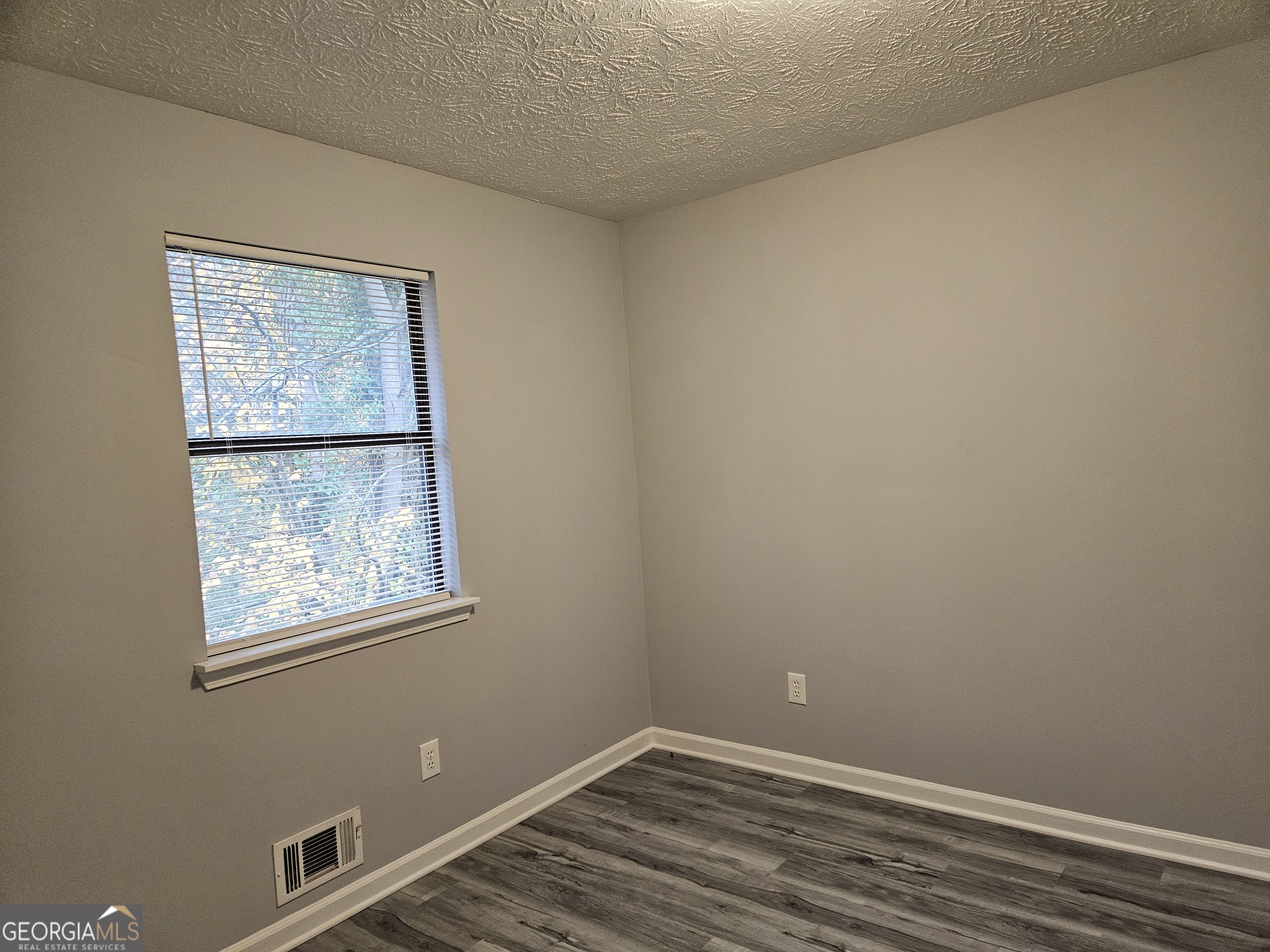 4321 Sebring Walk, Unit 5 Decatur, GA 30034 - Photo 10 of 31 a view of an empty room with a window