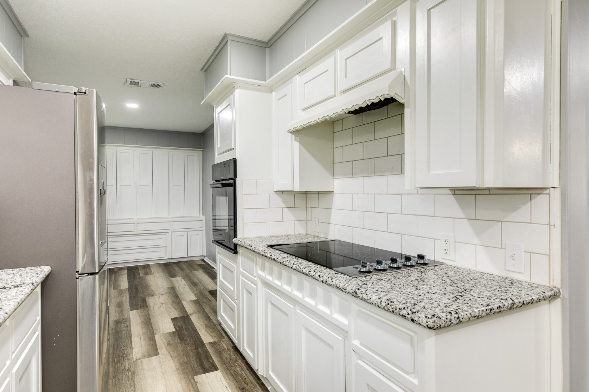908 West Mulberry Street Angleton, TX 77515 - Photo 11 of 22 a kitchen with a sink and cabinets