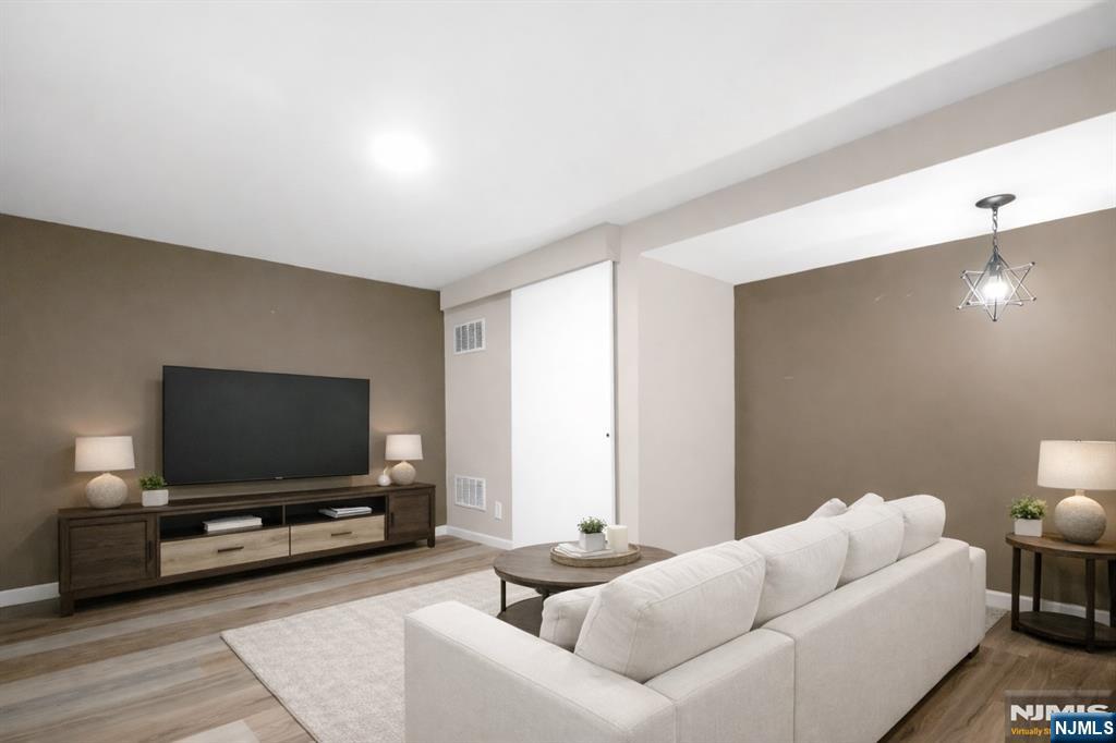 29 Martin Terrace Hackensack, NJ 07601 - Photo 40 of 50 a living room with furniture and a flat screen tv
