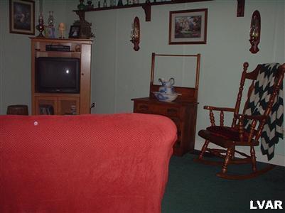 2333 West Best Road Bath, PA 18014 - Photo 3 of 8 a bedroom with a bed and a flat screen tv