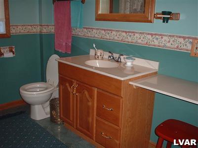 2333 West Best Road Bath, PA 18014 - Photo 8 of 8 a bathroom with a sink a toilet and mirror