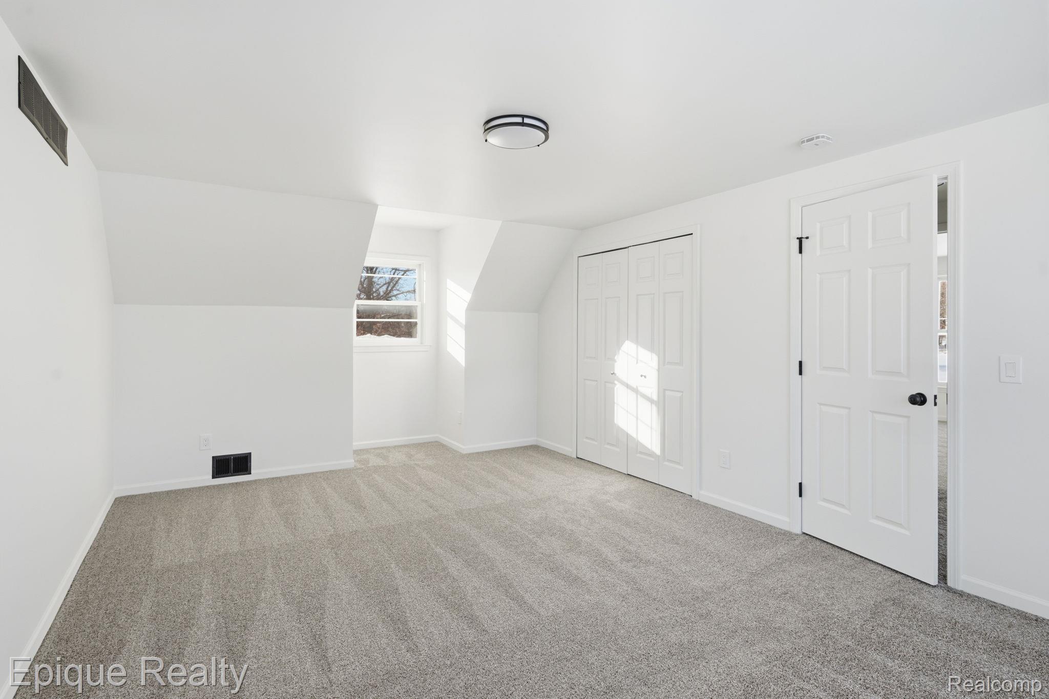 8680 Oakhill Road Clarkston, MI 48348 - Photo 23 of 52 Bonus room with light colored carpet and lofted ceiling
