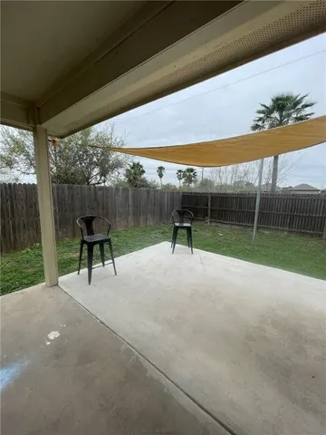 a view of backyard with trampoline