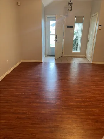 a view of a livingroom with a ceiling fan and window